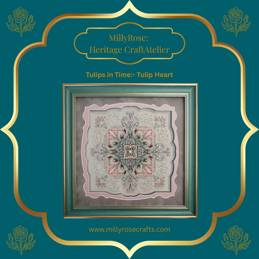 Completed Tulip Heart needlework piece featuring symmetrical pastel tulips, hand-dyed silks, and green crystals in a luxury teal frame with a scalloped mount.