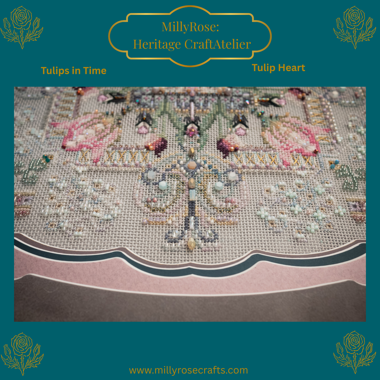 Completed Tulip Heart needlework piece featuring symmetrical pastel tulips, hand-dyed silks, and green crystals in a luxury teal frame with a scalloped mount.