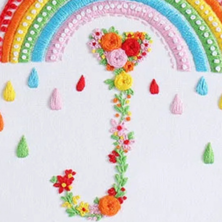 heart-shaped embroidery design with rainbow and flowers for beginners